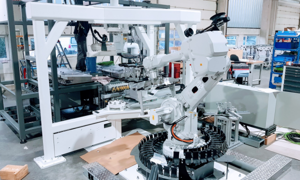 Robotic automation cell for custom machinery in industrial production